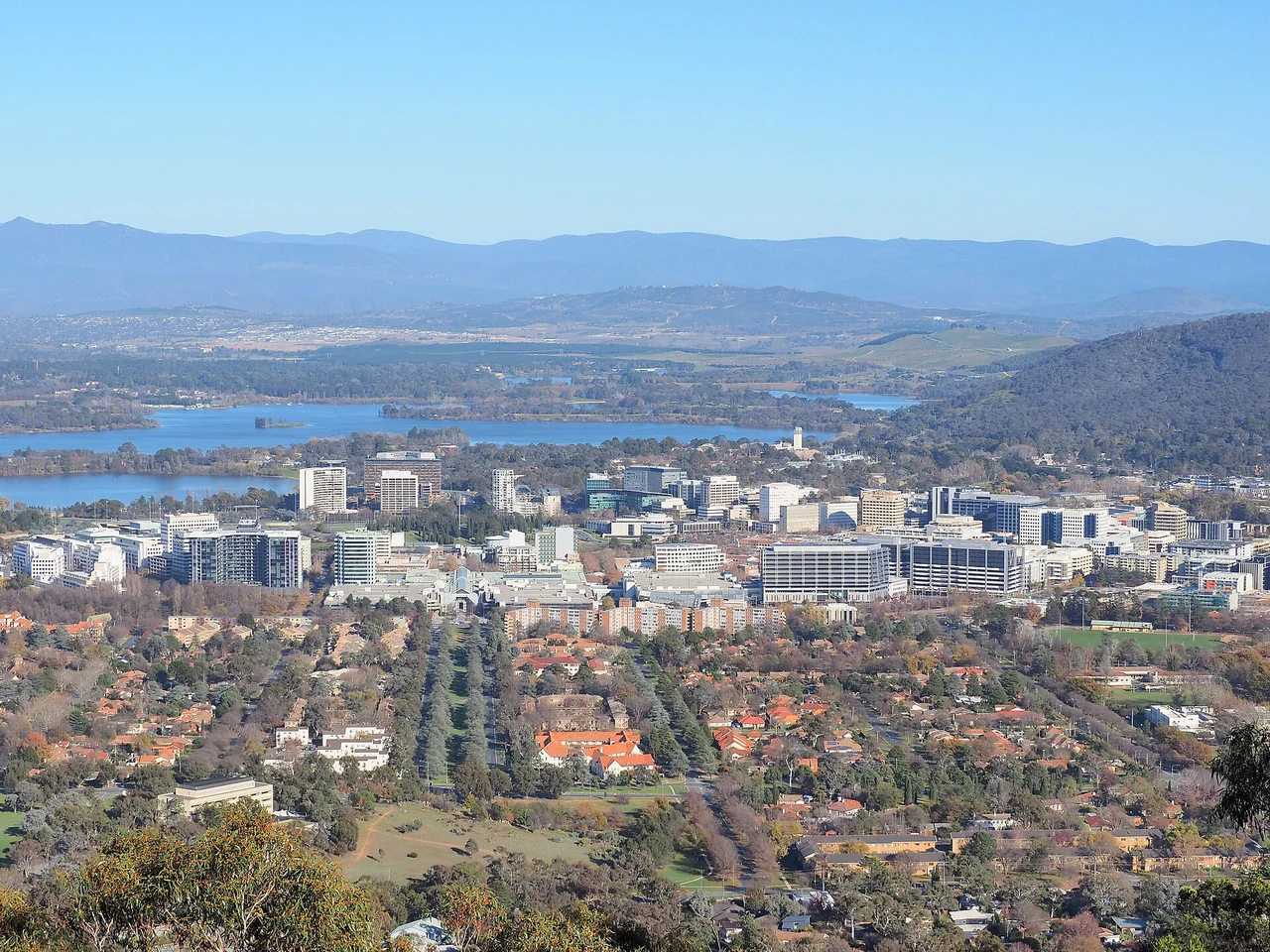 Canberra's city centre and Lake Burley Griffin viewed from Mount Ainslie, with the Brindabella ranges beyond.