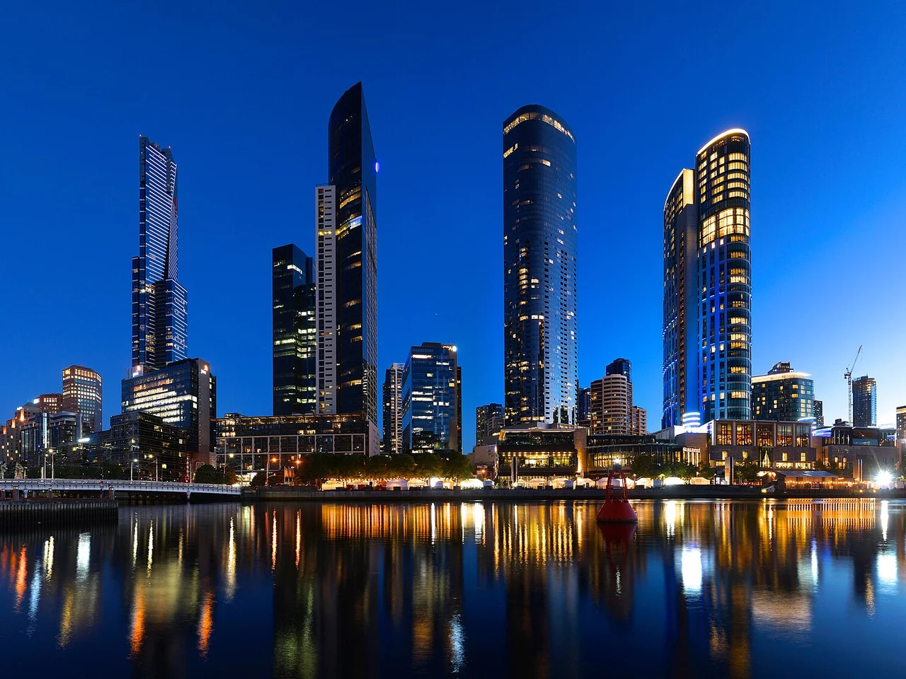 Melbourne's Southbank skyline reflected in the Yarra River at dusk.